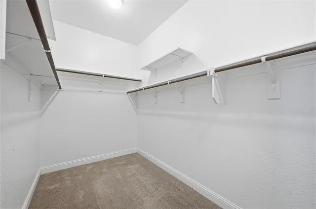 a view of an empty walk in closet