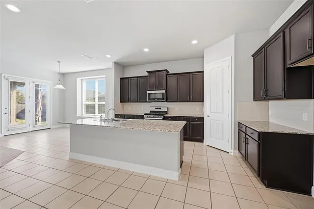 a large kitchen with cabinets