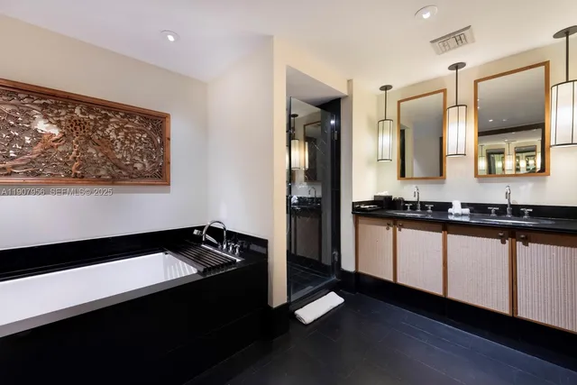 a bathroom with a sink and a large mirror