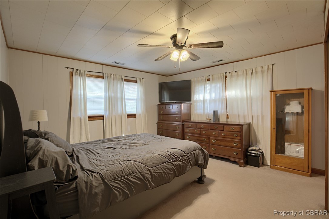 954 Carlton Road Wake, VA 23176 - Photo 10 of 25 Carpeted bedroom featuring ceiling fan and ornamental molding