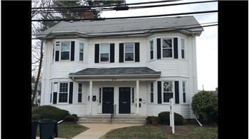 84 South, Unit 84 Waltham, MA 02451 - Photo 2 of 9 front view of house with a yard