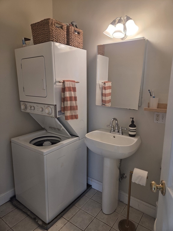 84 South, Unit 84 Waltham, MA 02451 - Photo 7 of 9 a bathroom with a sink a toilet and mirror