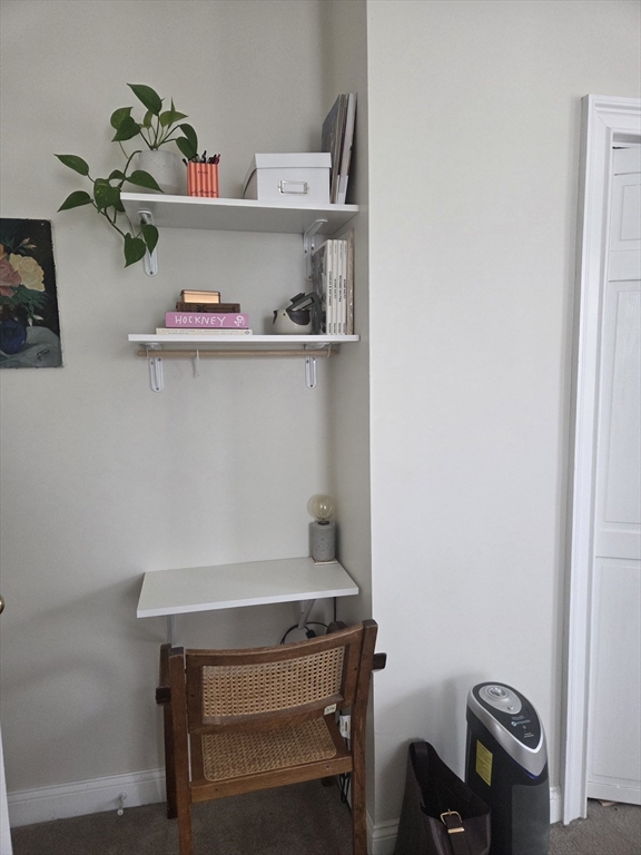 84 South, Unit 84 Waltham, MA 02451 - Photo 9 of 9 a room with a table and a potted plant
