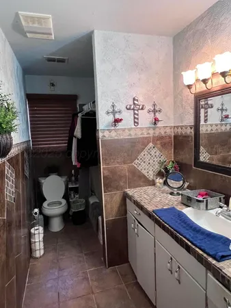 a bathroom with a sink and a toilet