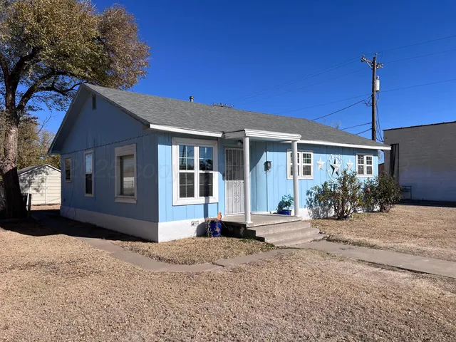 a front view of a house with a outdoor space
