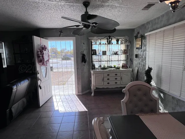 a room with gym equipment and large window