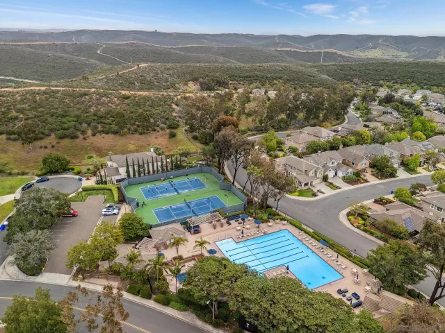an aerial view of residential houses with outdoor space