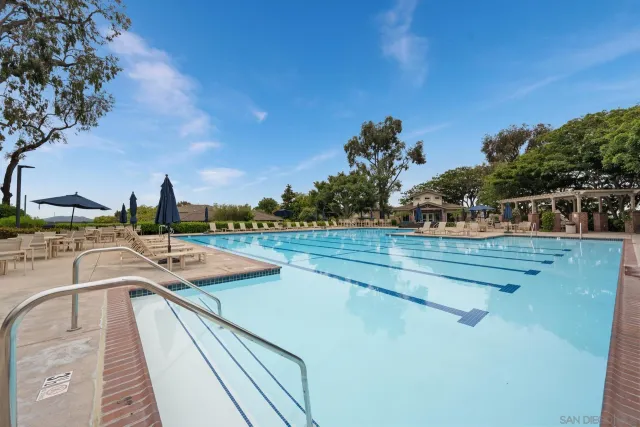 a view of a swimming pool with a lounge chair