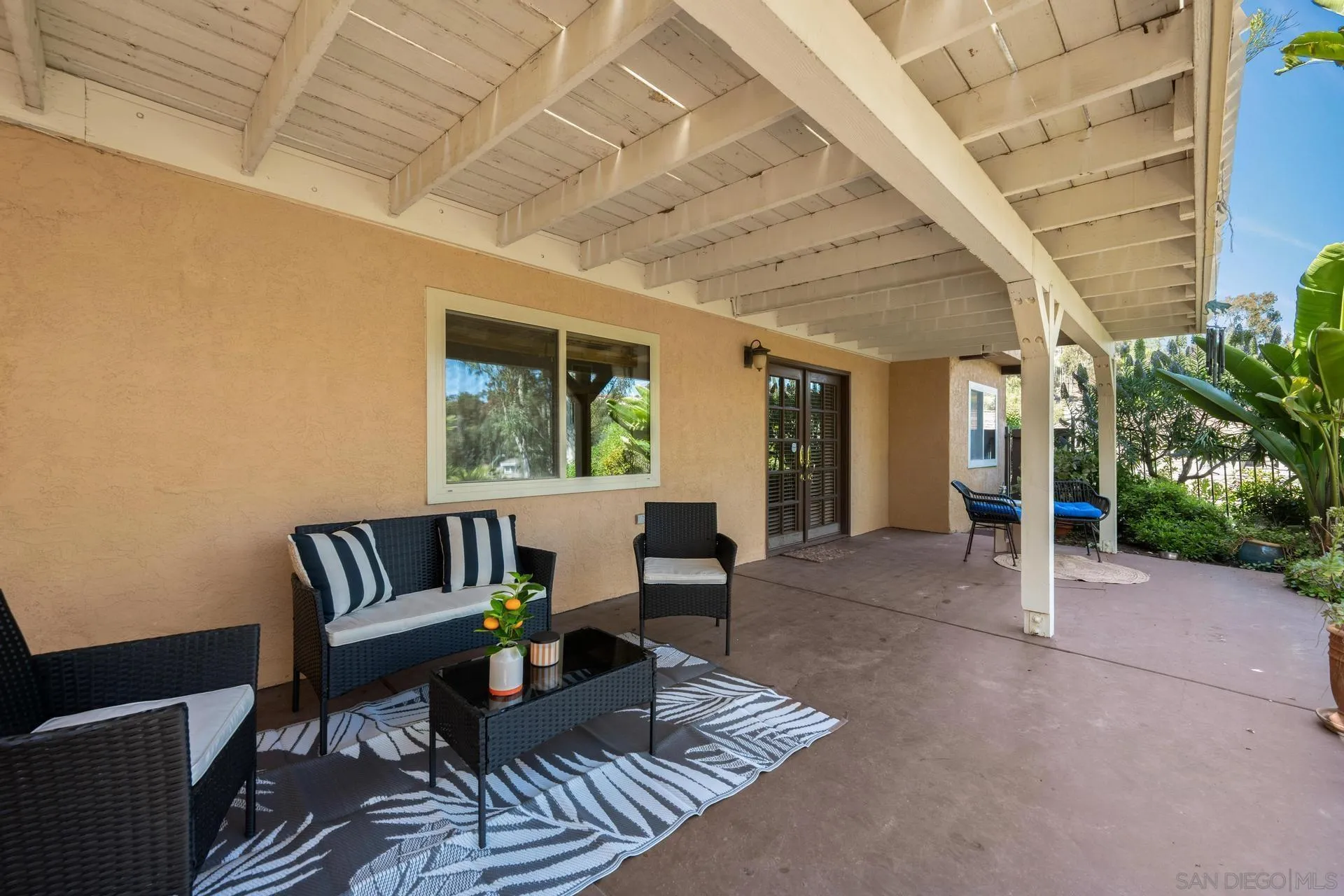 10575 Spruce Grove Avenue San Diego, CA 92131 - Photo 29 of 33 a living room with furniture and a large window