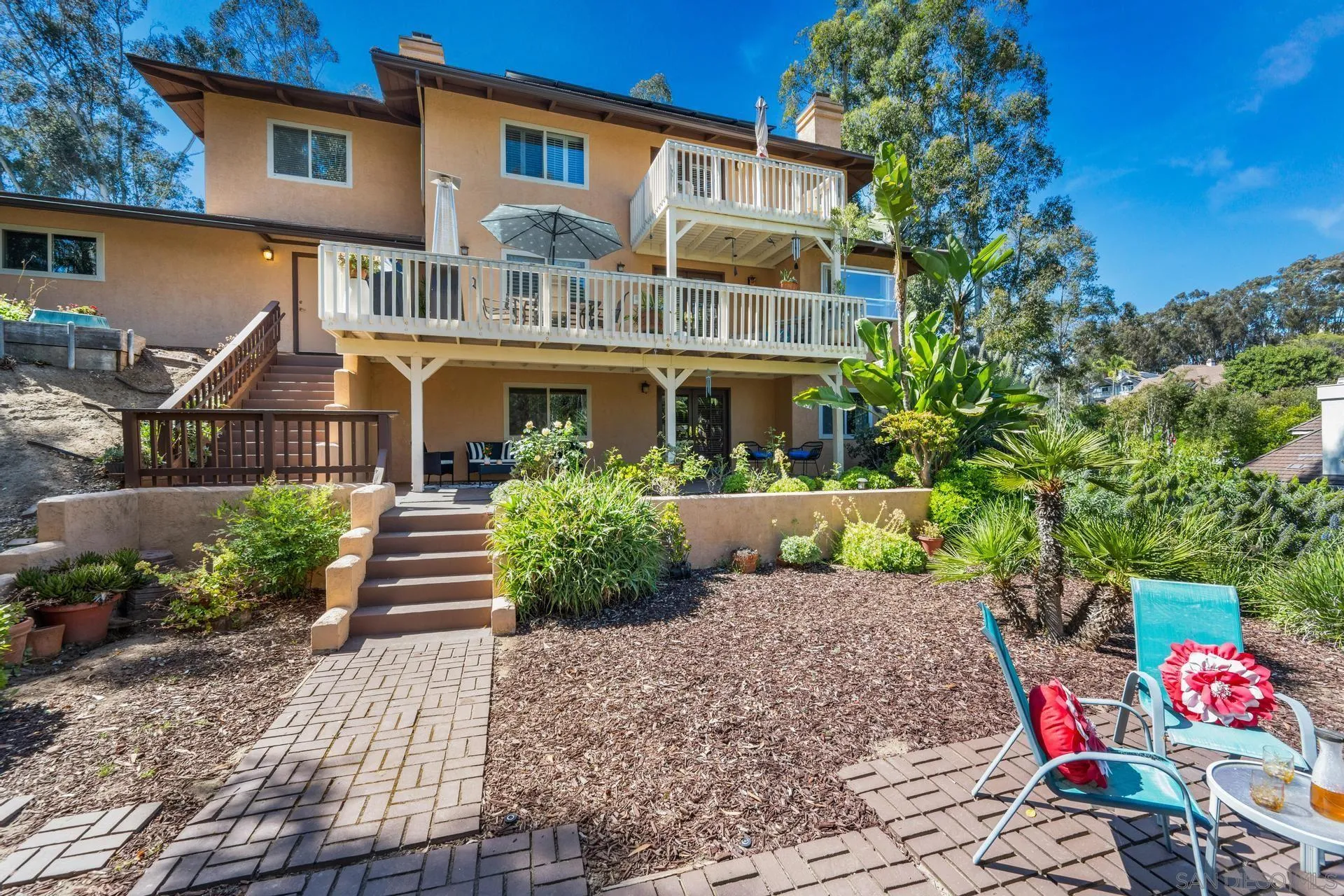 10575 Spruce Grove Avenue San Diego, CA 92131 - Photo 30 of 33 a front view of a house with garden