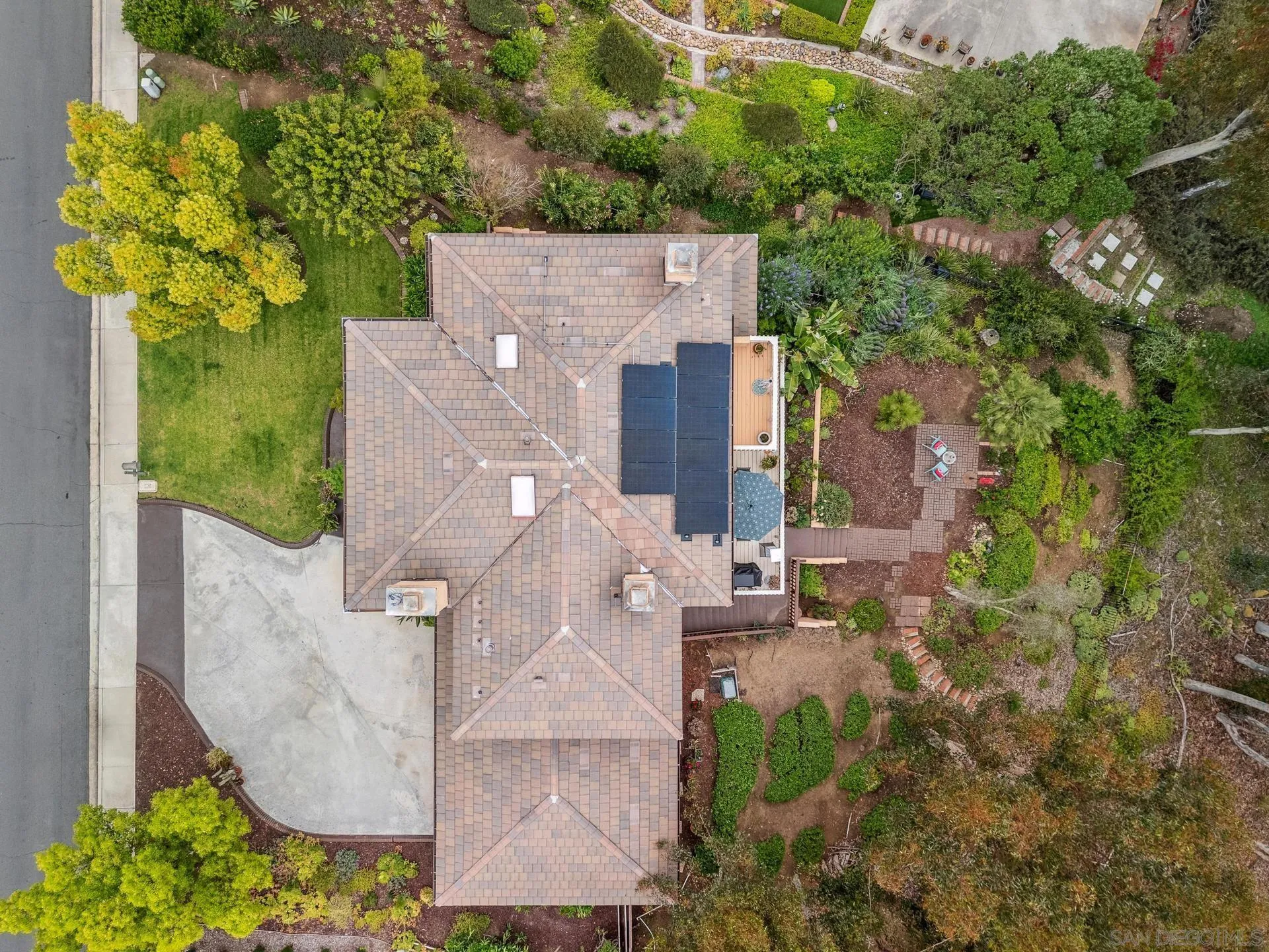 10575 Spruce Grove Avenue San Diego, CA 92131 - Photo 32 of 33 an aerial view of a house with a yard and garden