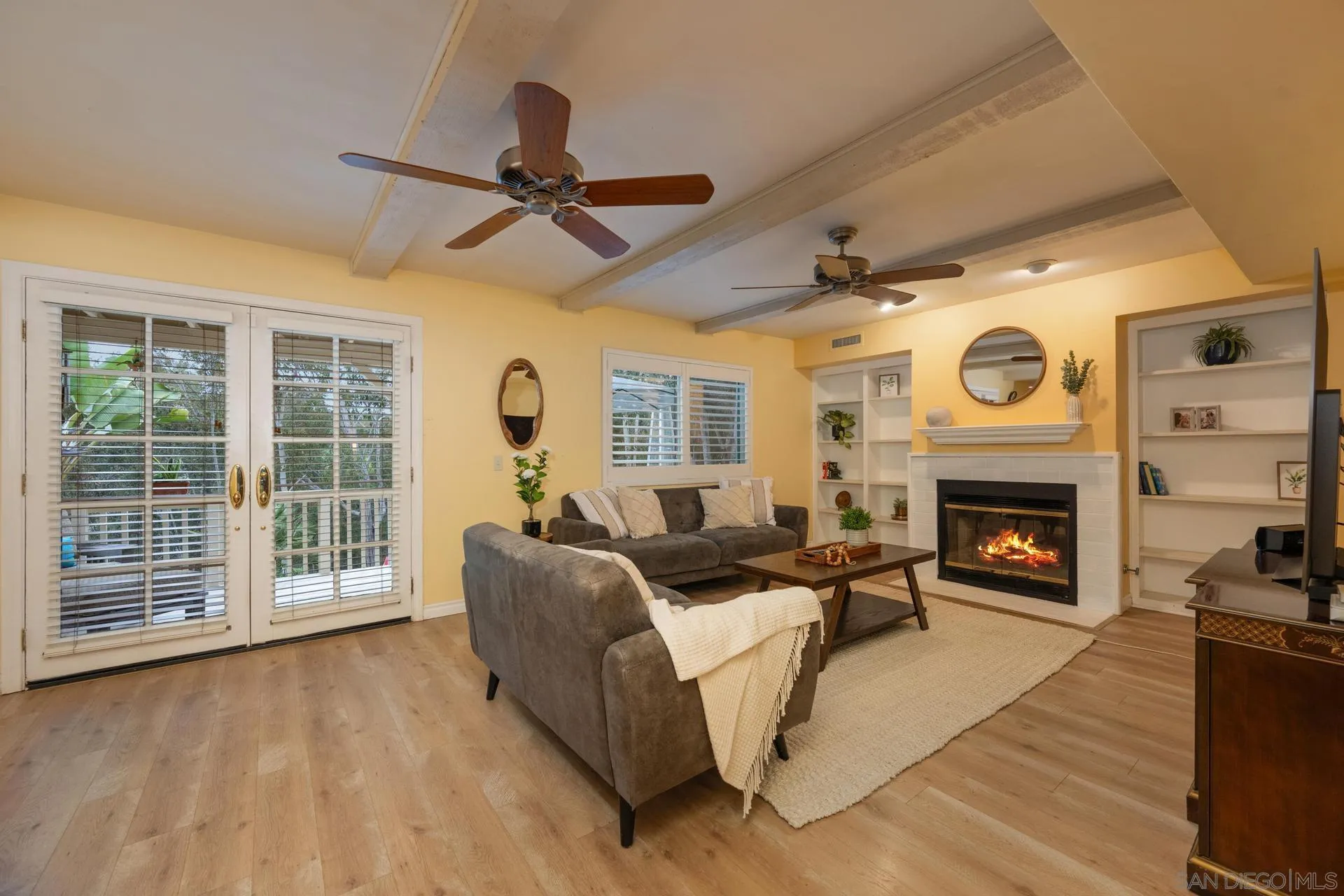 10575 Spruce Grove Avenue San Diego, CA 92131 - Photo 7 of 33 a living room with furniture and a fireplace