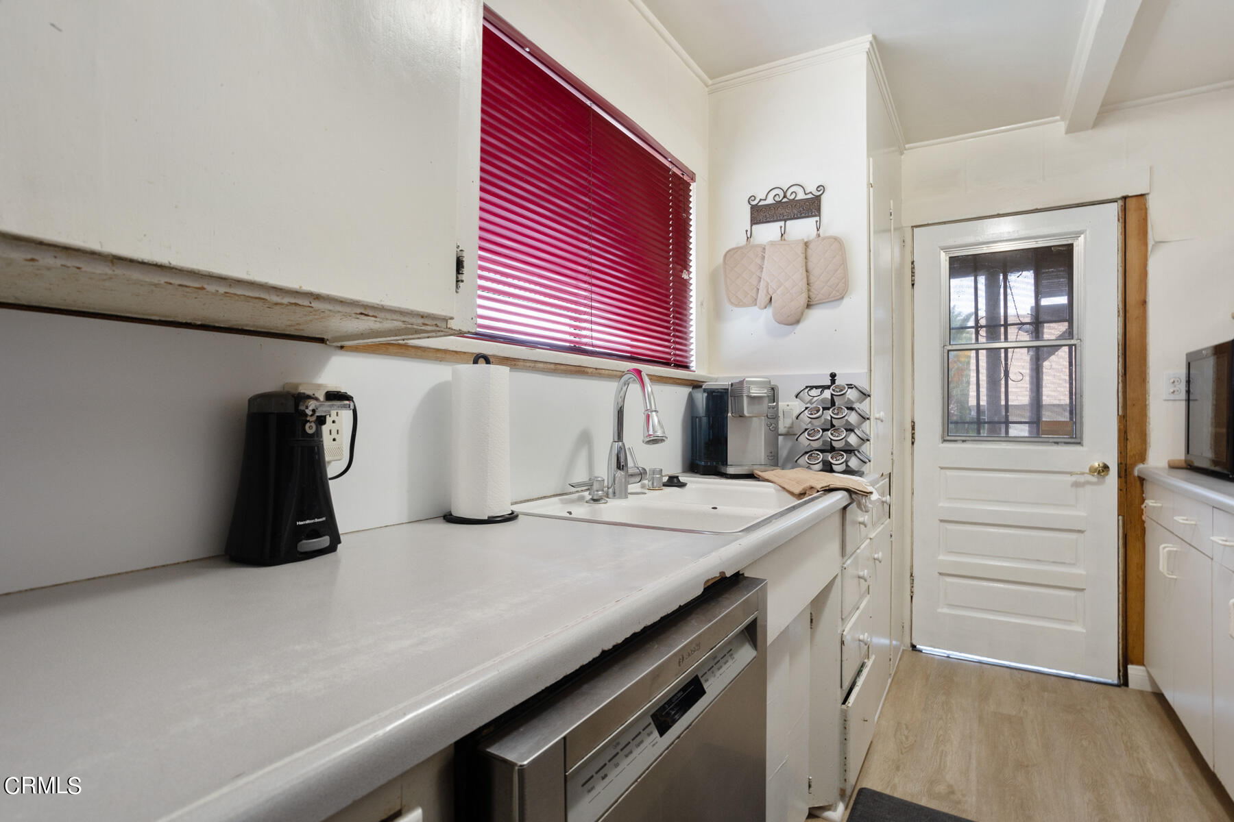 7518 Kyle Street Tujunga, CA 91042 - Photo 13 of 28 a kitchen with a refrigerator and a sink