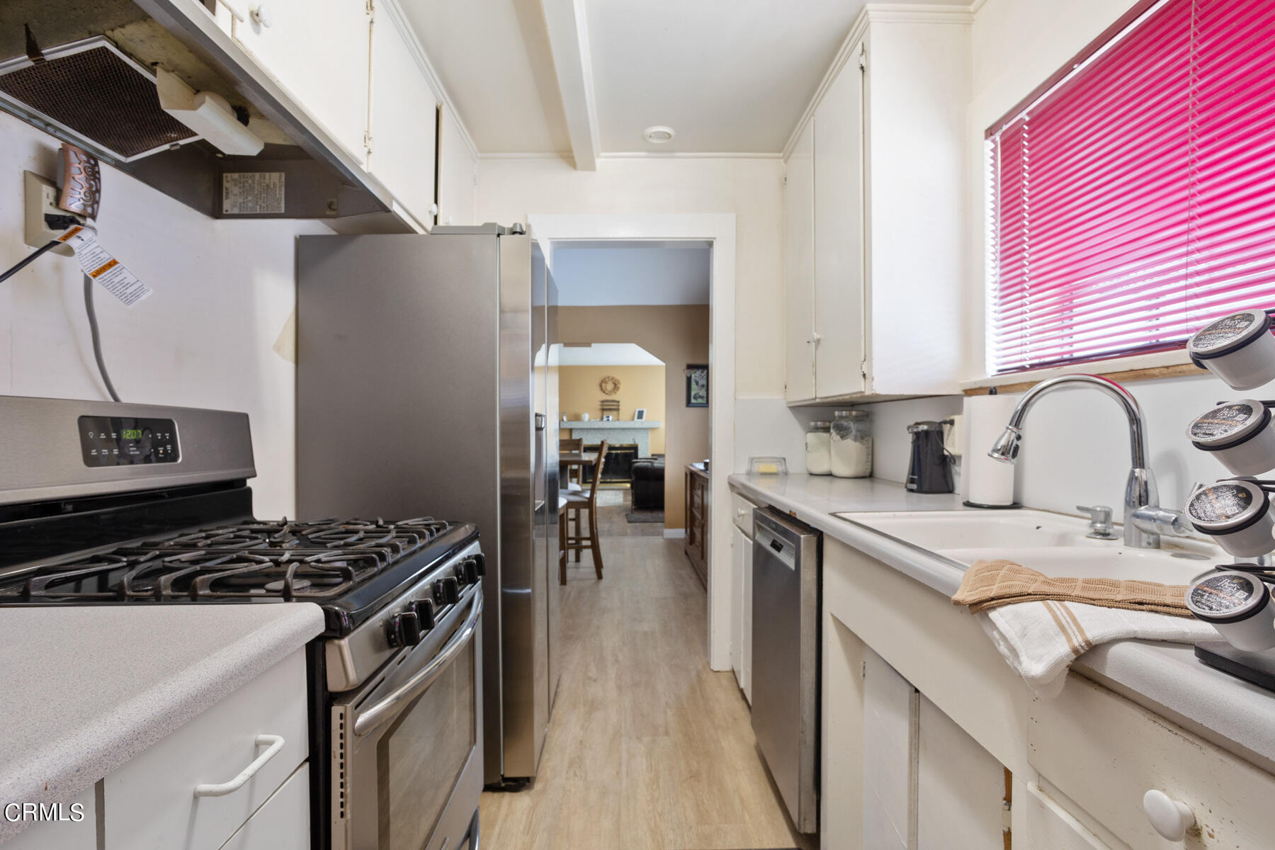 7518 Kyle Street Tujunga, CA 91042 - Photo 15 of 28 a kitchen with stainless steel appliances granite countertop a sink stove and cabinets