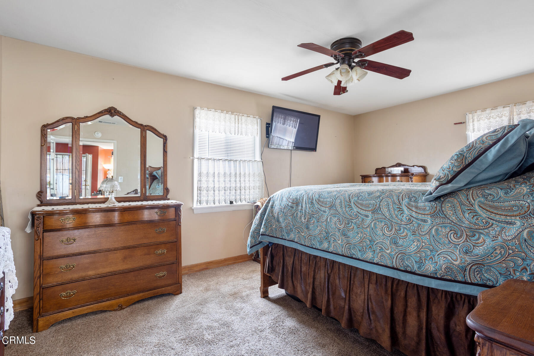 7518 Kyle Street Tujunga, CA 91042 - Photo 17 of 28 a bedroom with a bed and a dresser