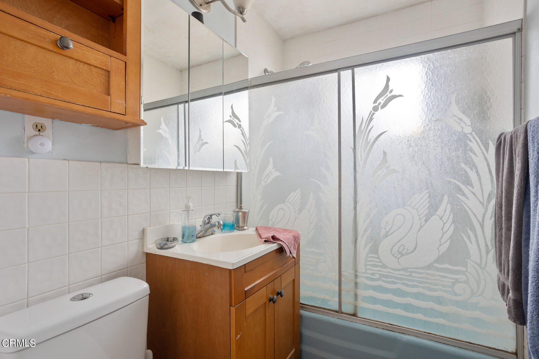 7518 Kyle Street Tujunga, CA 91042 - Photo 18 of 28 a bathroom with a granite countertop sink a toilet and shower