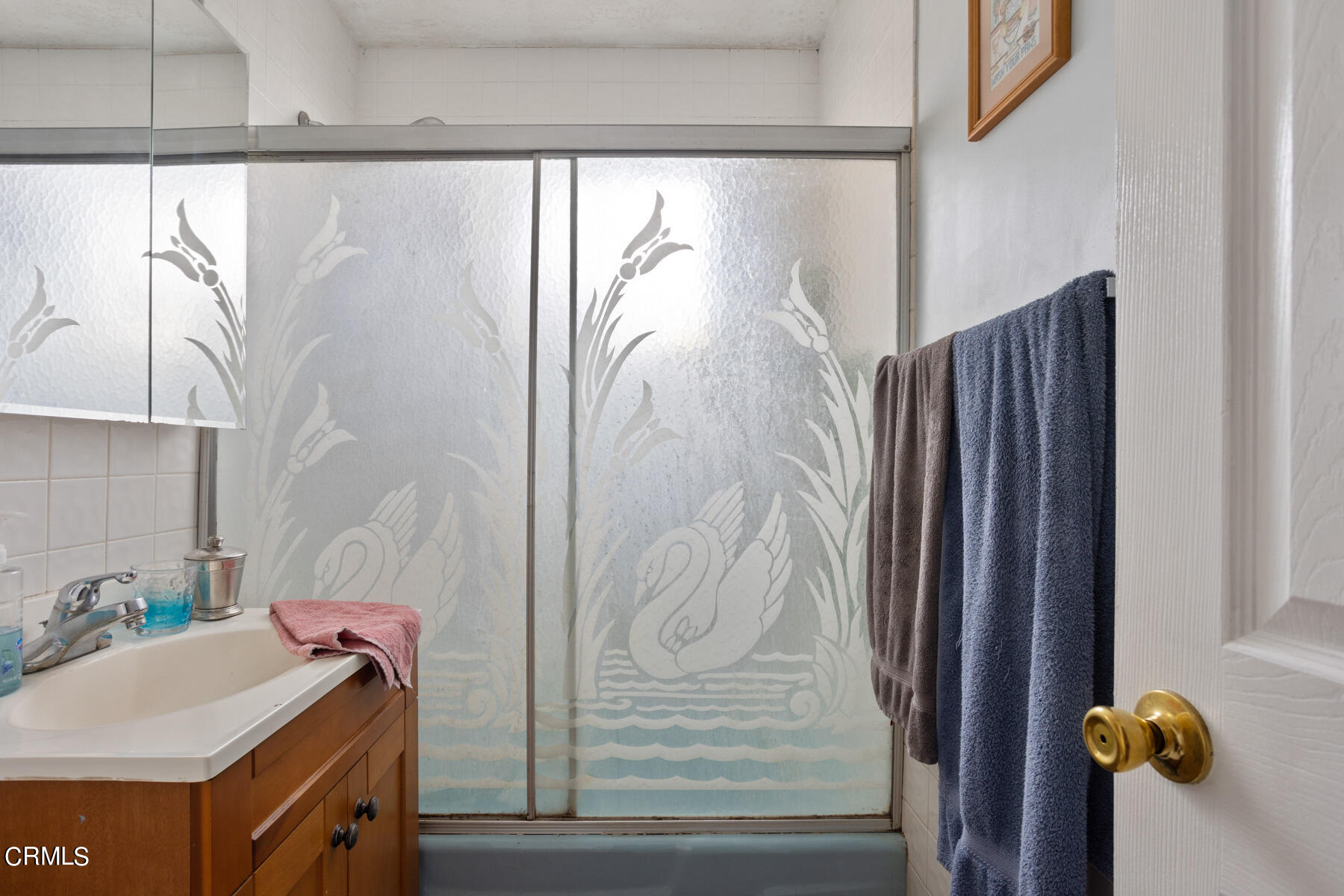 7518 Kyle Street Tujunga, CA 91042 - Photo 19 of 28 a bathroom with a sink and mirror