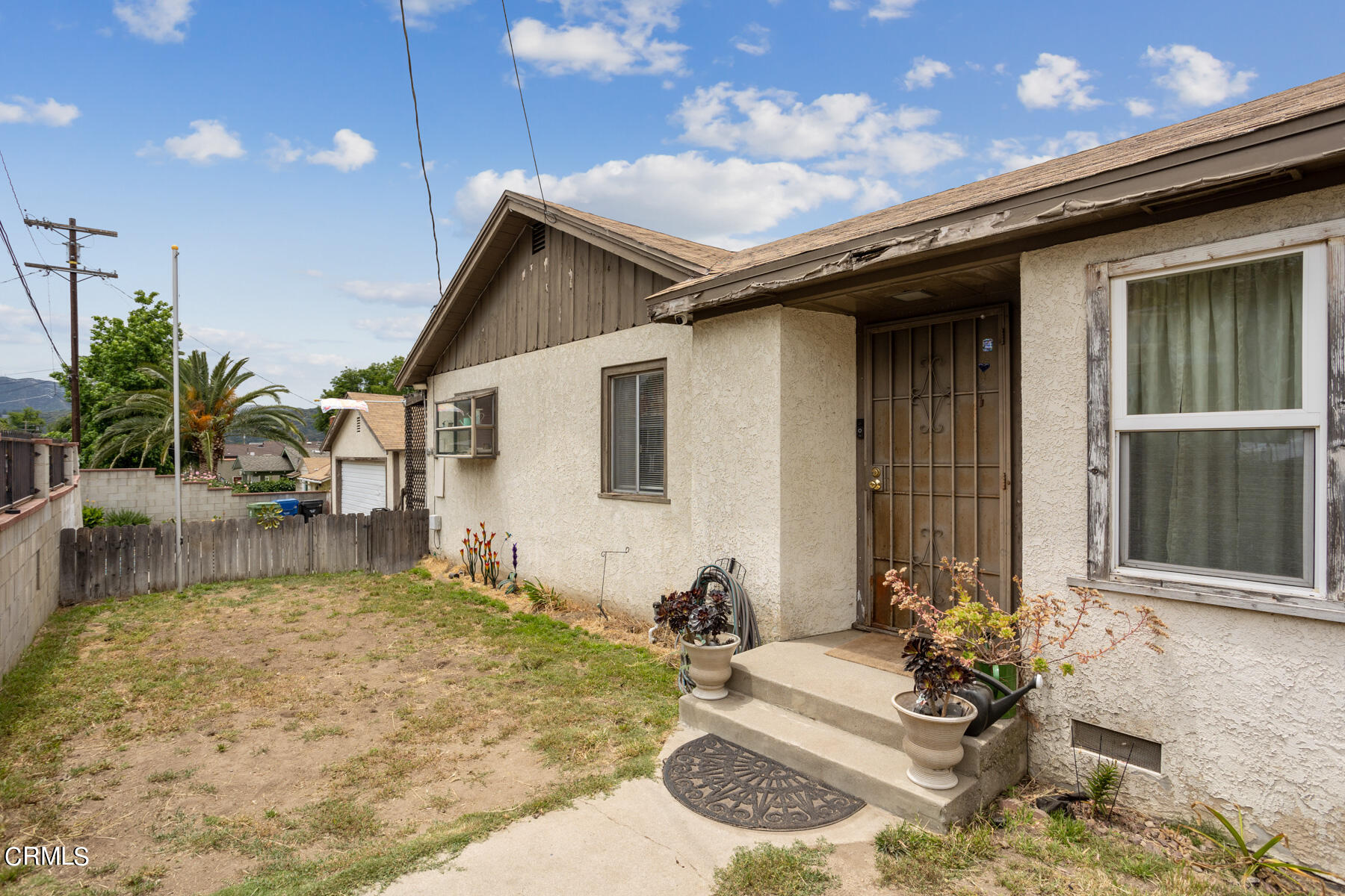 7518 Kyle Street Tujunga, CA 91042 - Photo 2 of 28 a backyard of a house with seating space