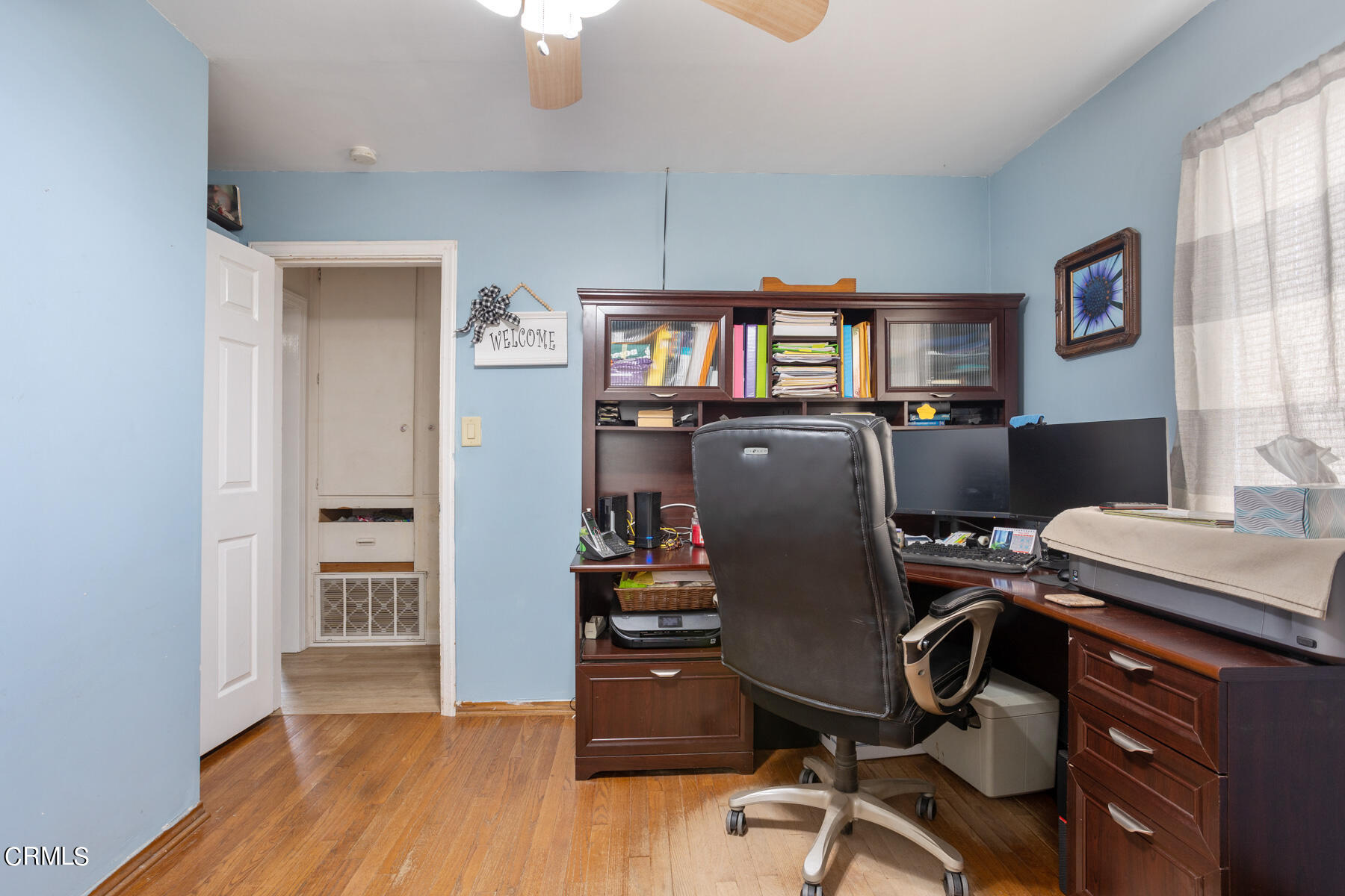 7518 Kyle Street Tujunga, CA 91042 - Photo 21 of 28 a view of a workspace with furniture and a window