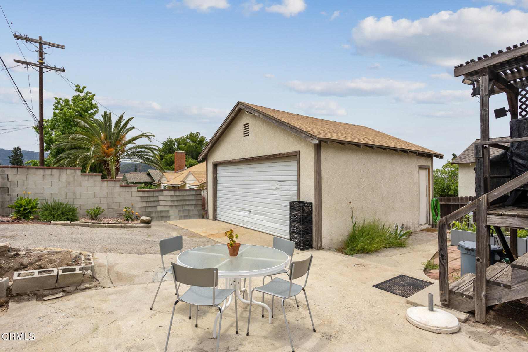 7518 Kyle Street Tujunga, CA 91042 - Photo 27 of 28 a backyard of a house with table and chairs