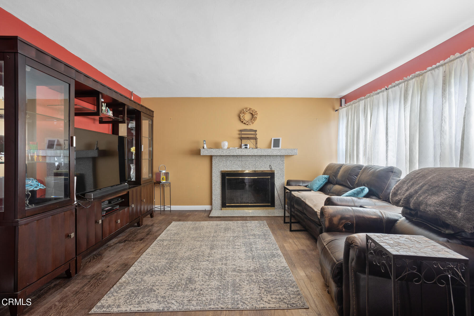 7518 Kyle Street Tujunga, CA 91042 - Photo 5 of 28 a living room with furniture and a fireplace