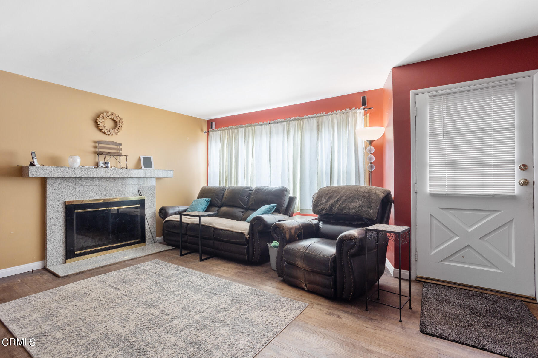 7518 Kyle Street Tujunga, CA 91042 - Photo 6 of 28 a living room with furniture and a fireplace