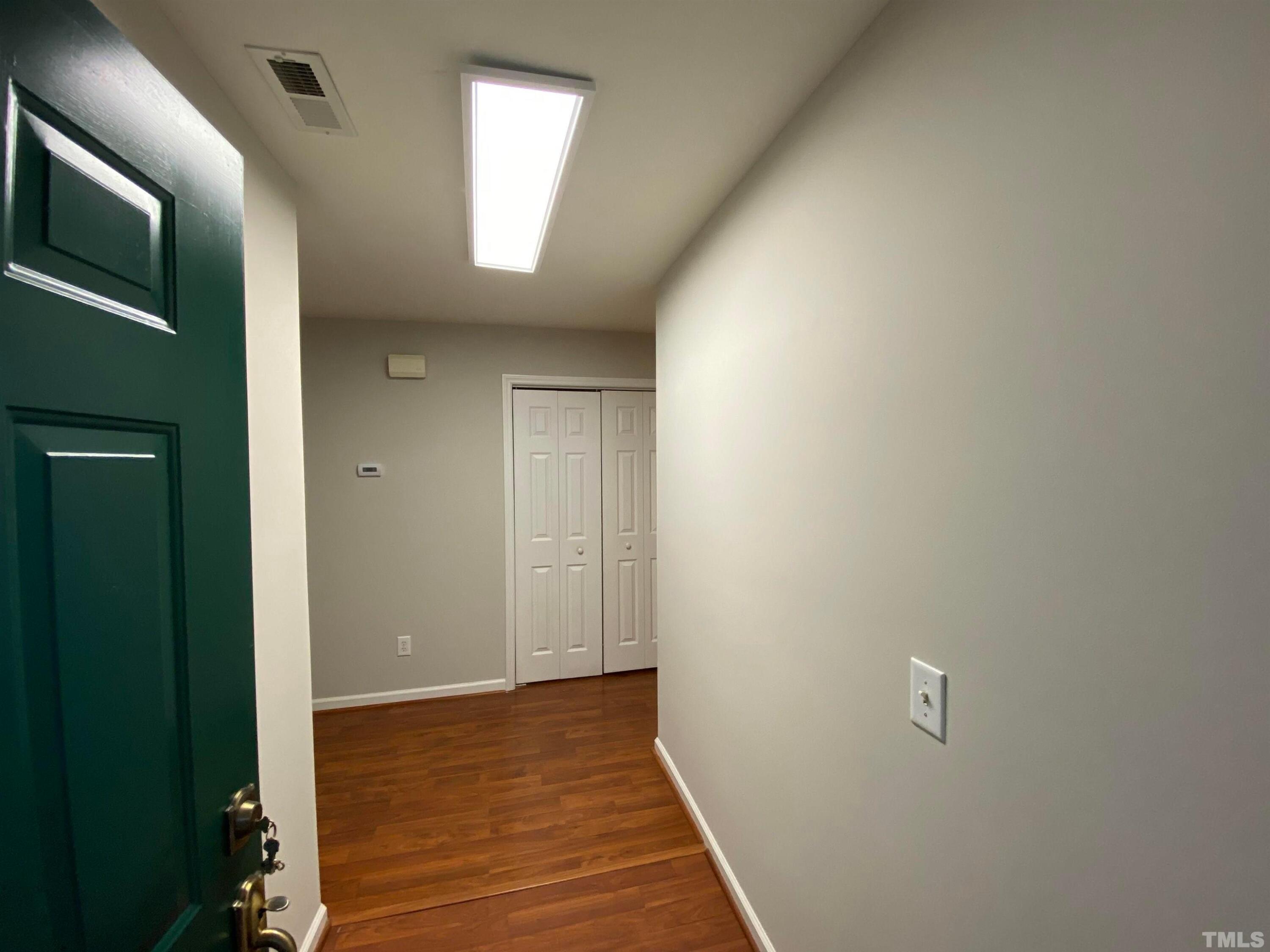 2413 Wellington Ridge Loop, Unit 2413 Cary, NC 27518 - Photo 4 of 30 a view of hallway with wooden floor