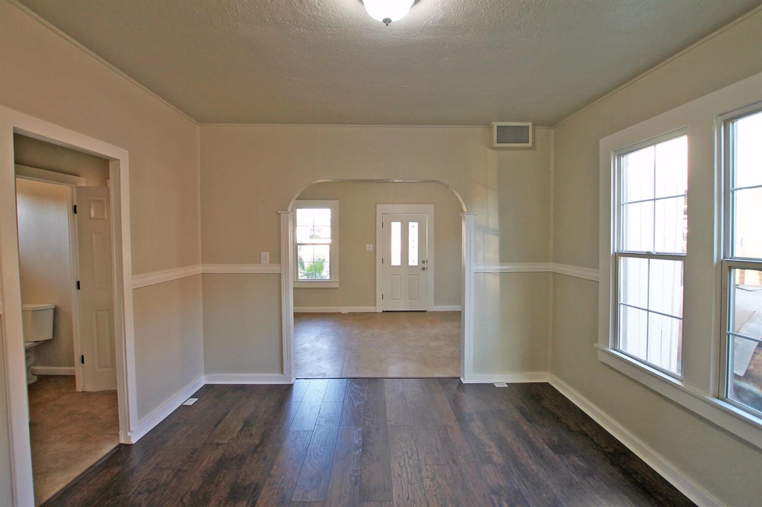 1115 M Street Reedley, CA 93654 - Photo 10 of 10 wooden floor in an empty room with a window