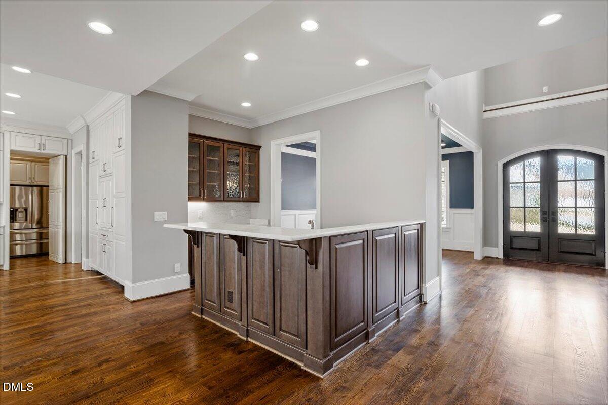 12616 Village Springs Road Raleigh, NC 27614 - Photo 18 of 89 a view of a hallway with wooden floor and windows