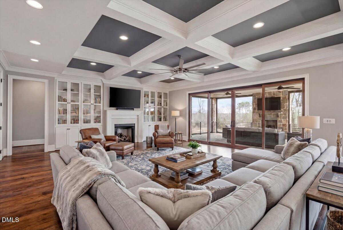 12616 Village Springs Road Raleigh, NC 27614 - Photo 21 of 89 a living room with furniture fireplace and flat screen tv