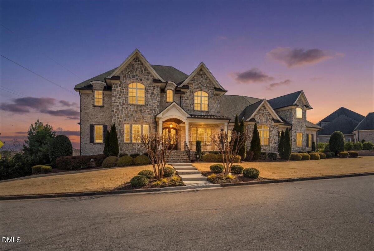 12616 Village Springs Road Raleigh, NC 27614 - Photo 2 of 89 a front view of a house with a yard