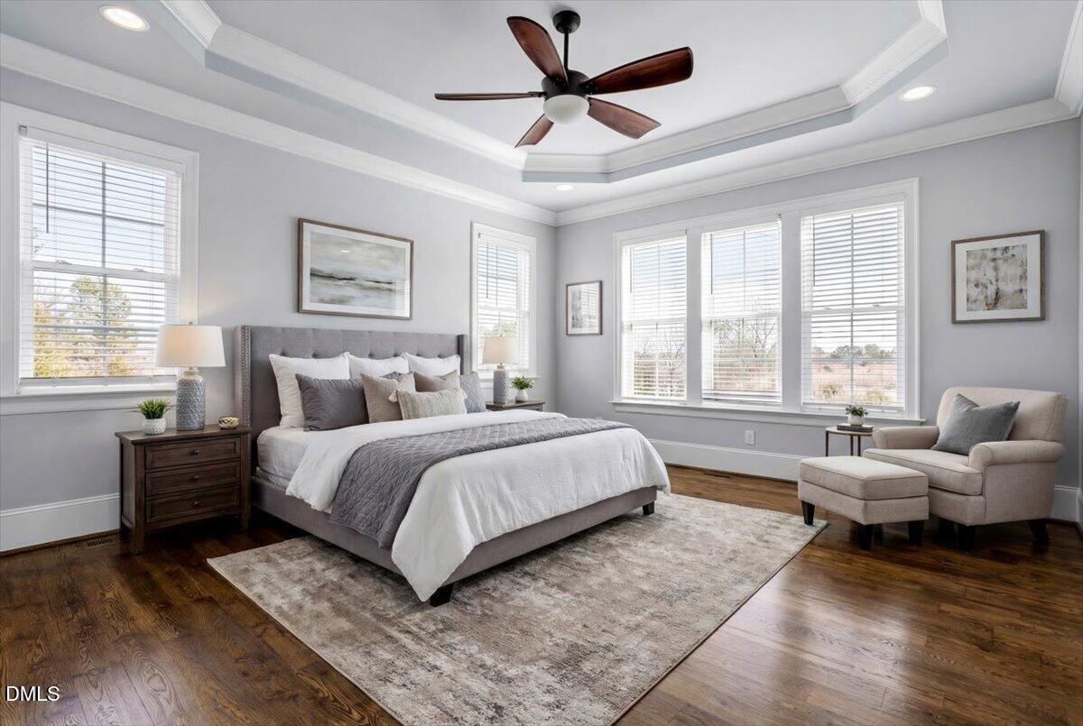 12616 Village Springs Road Raleigh, NC 27614 - Photo 43 of 89 a spacious bedroom with a bed and glass windows