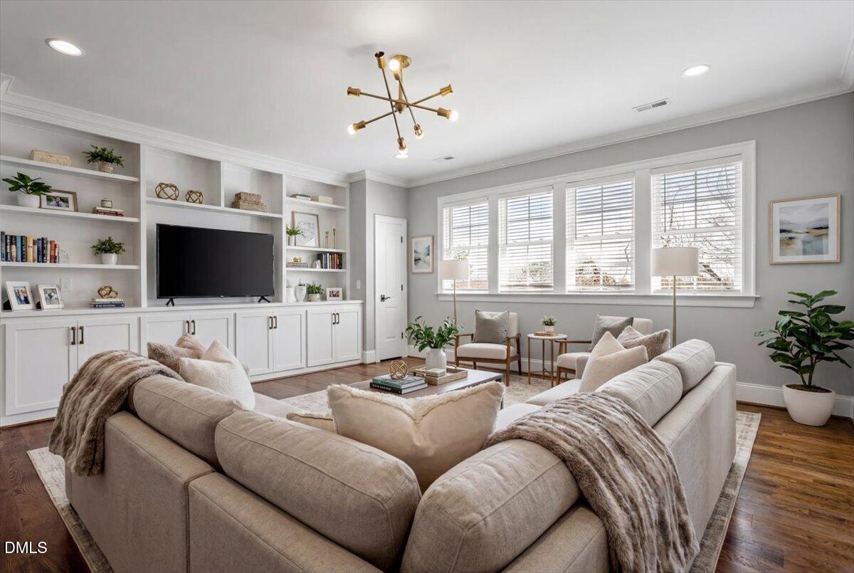 12616 Village Springs Road Raleigh, NC 27614 - Photo 51 of 89 a living room with furniture and a flat screen tv