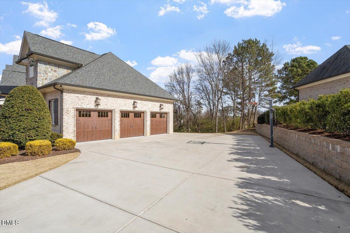 12616 Village Springs Road Raleigh, NC 27614 - Photo 5 of 89 a view of a house with a yard and pathway