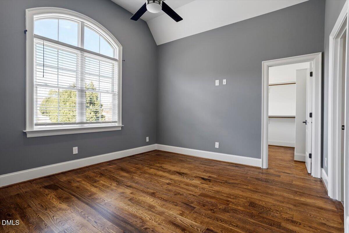 12616 Village Springs Road Raleigh, NC 27614 - Photo 64 of 89 wooden floor in an empty room with a window