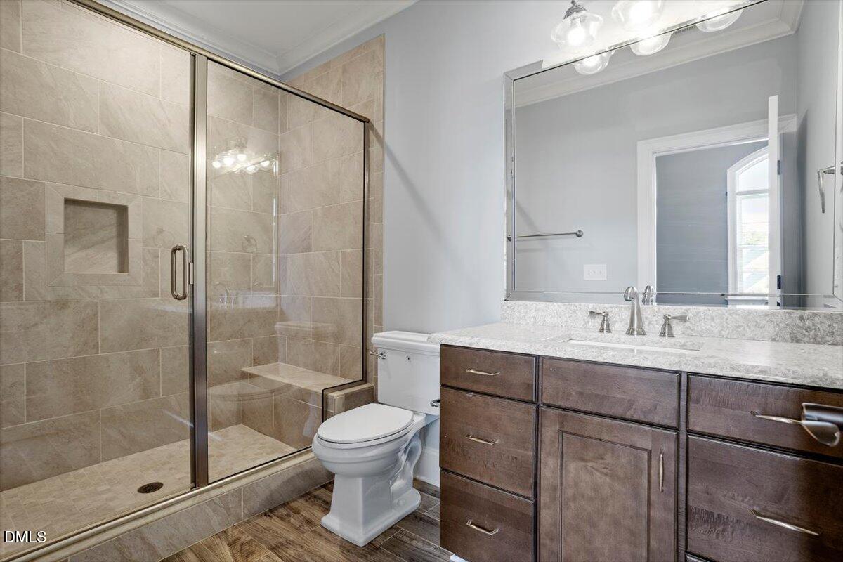 12616 Village Springs Road Raleigh, NC 27614 - Photo 66 of 89 a bathroom with a toilet sink and shower
