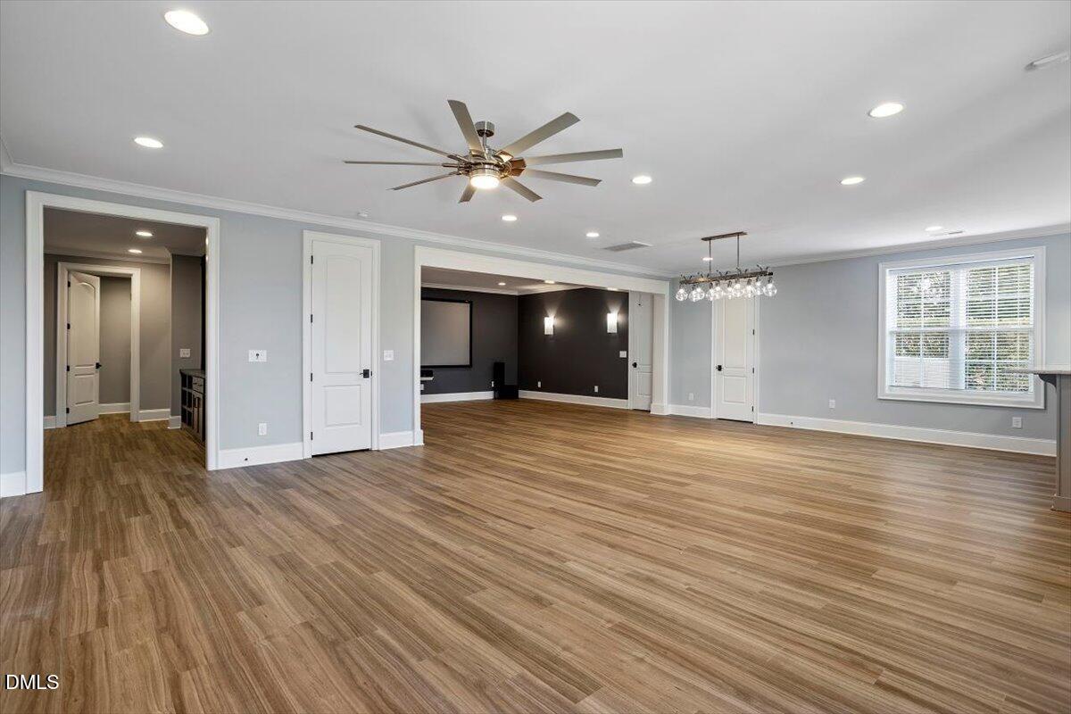 12616 Village Springs Road Raleigh, NC 27614 - Photo 70 of 89 a view of an empty room with window and wooden floor