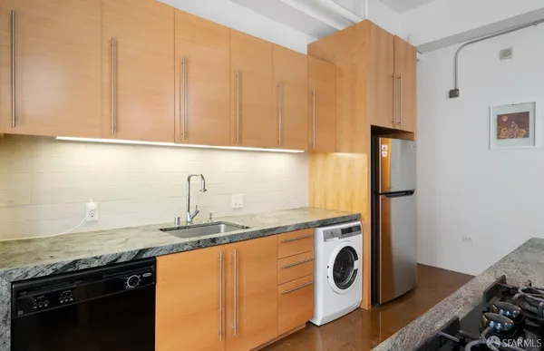 a kitchen with a sink and a stove