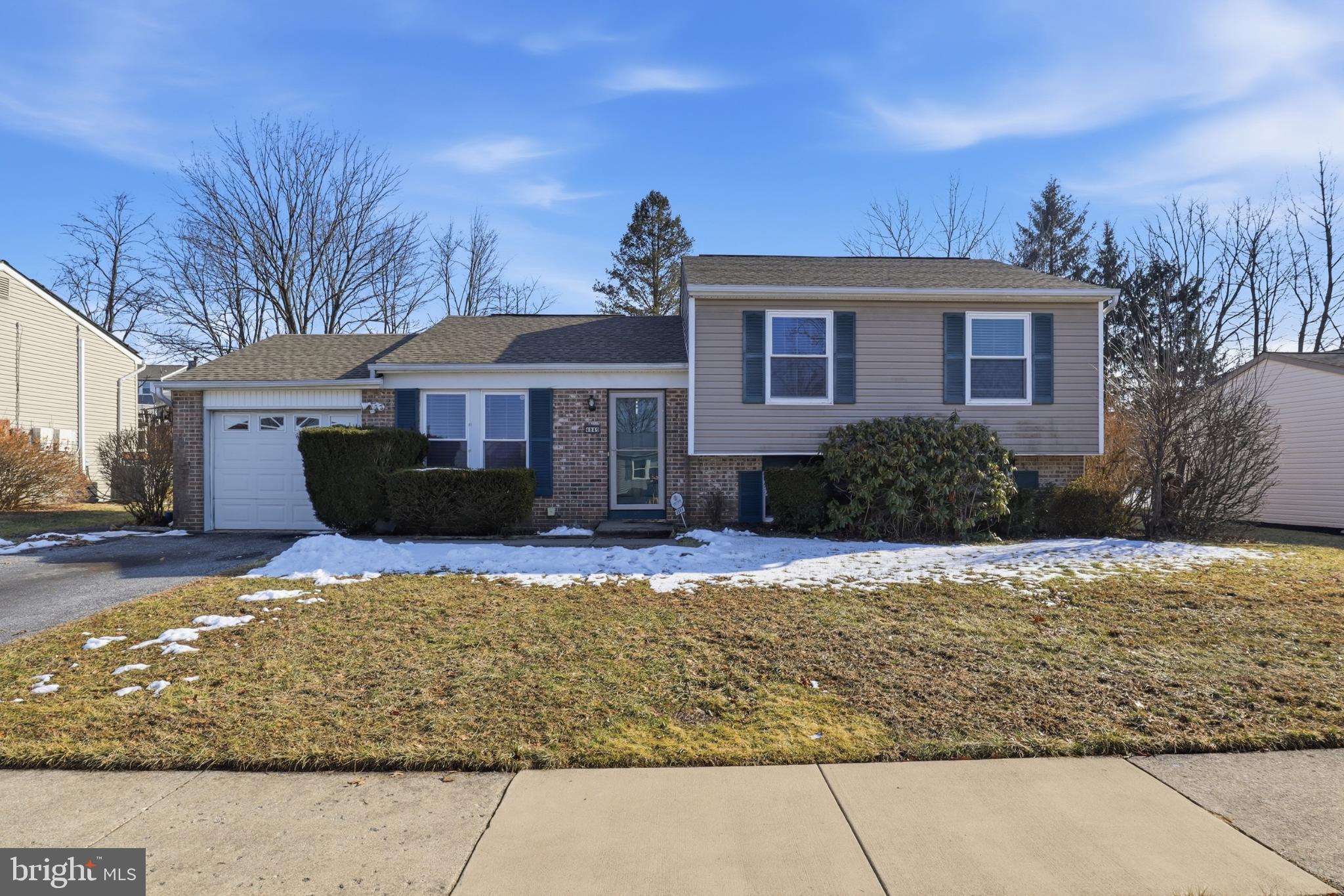 4849 Springtop Drive Harrisburg, PA 17111 - Photo 1 of 42 a front view of a house with a yard