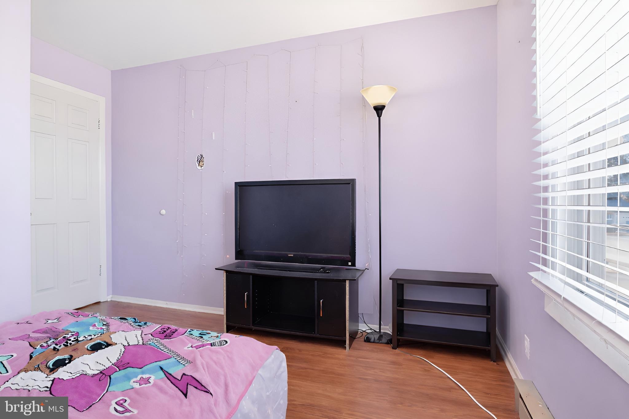 4849 Springtop Drive Harrisburg, PA 17111 - Photo 13 of 42 a bedroom with a bed and a flat screen tv