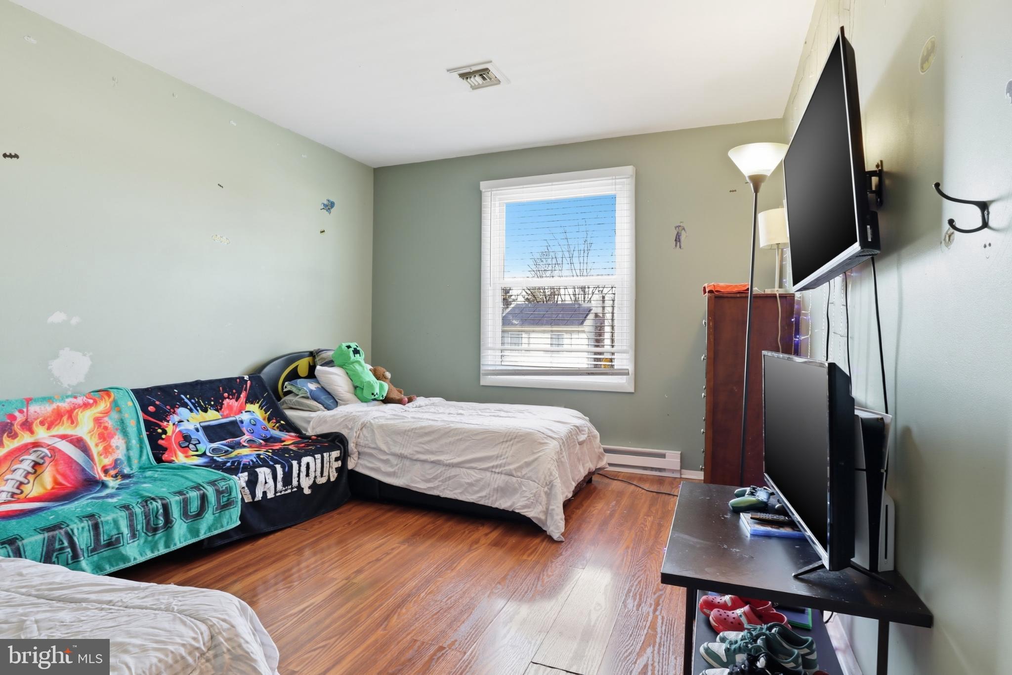 4849 Springtop Drive Harrisburg, PA 17111 - Photo 14 of 42 a bedroom with furniture and a flat screen tv