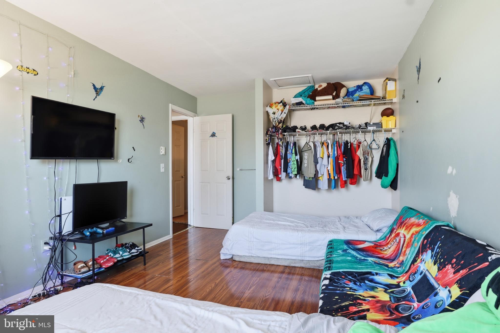 4849 Springtop Drive Harrisburg, PA 17111 - Photo 15 of 42 a living room with furniture and a flat screen tv