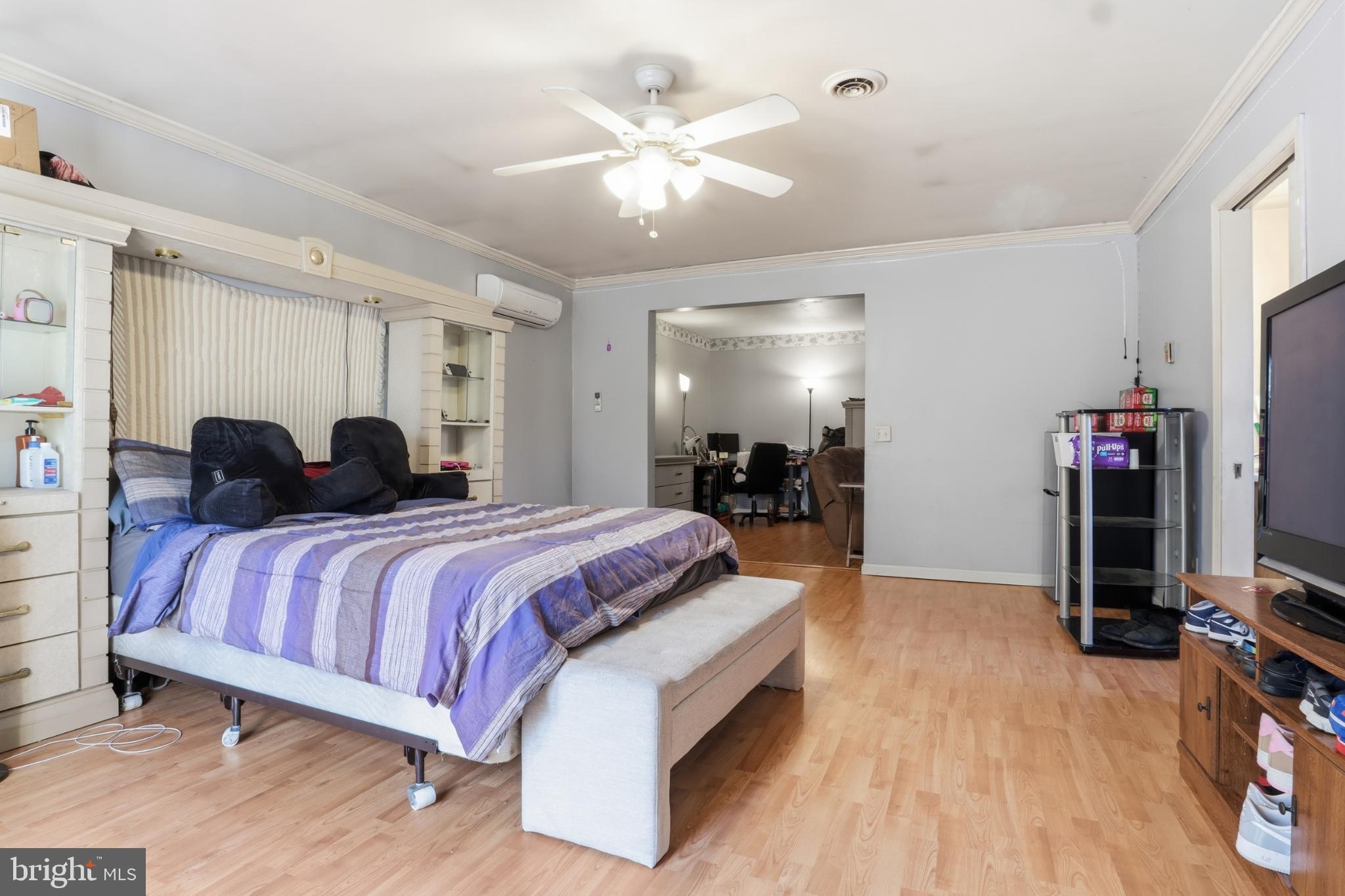 4849 Springtop Drive Harrisburg, PA 17111 - Photo 20 of 42 a spacious bedroom with a bed and a chandelier