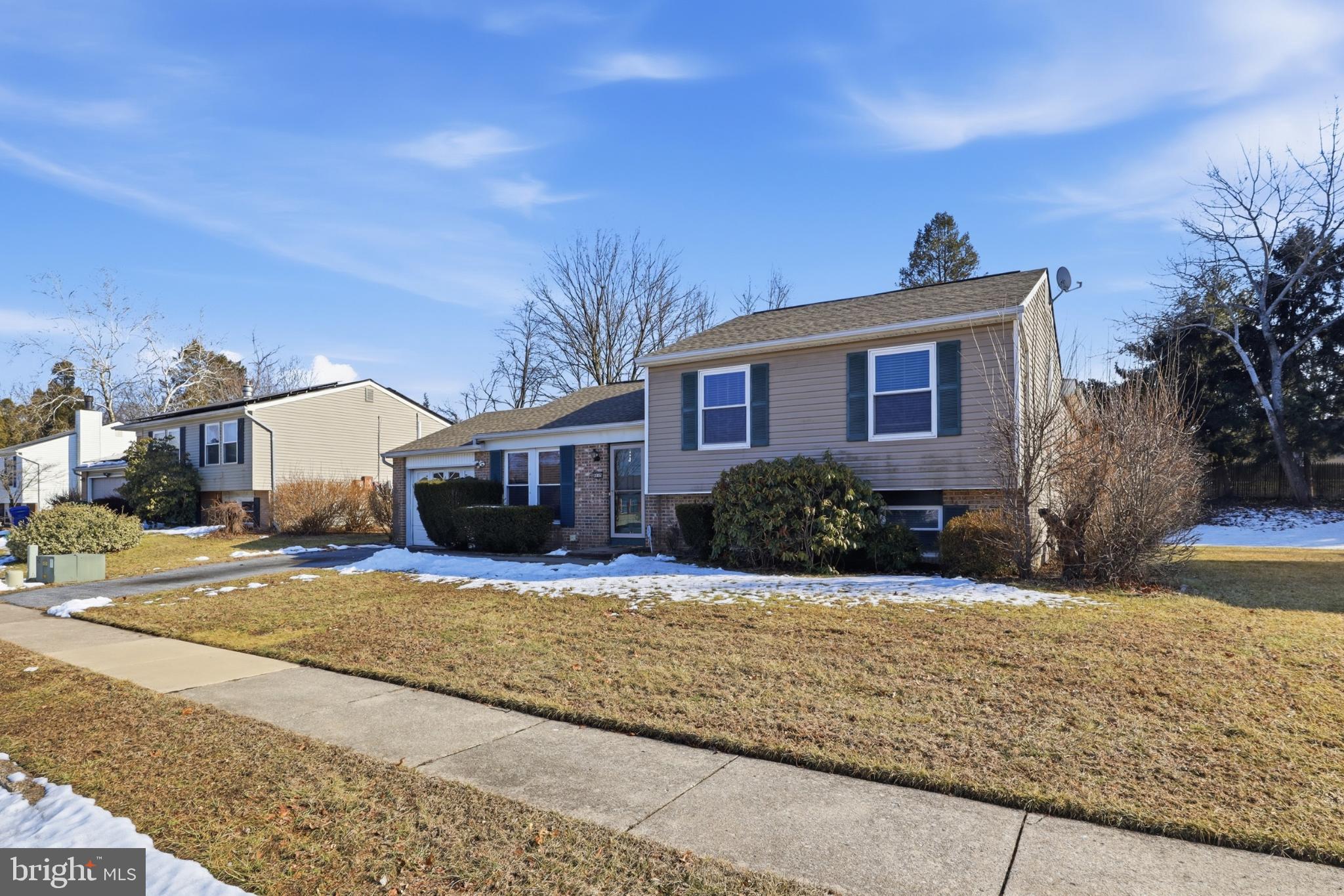 4849 Springtop Drive Harrisburg, PA 17111 - Photo 2 of 42 a front view of a house with a yard