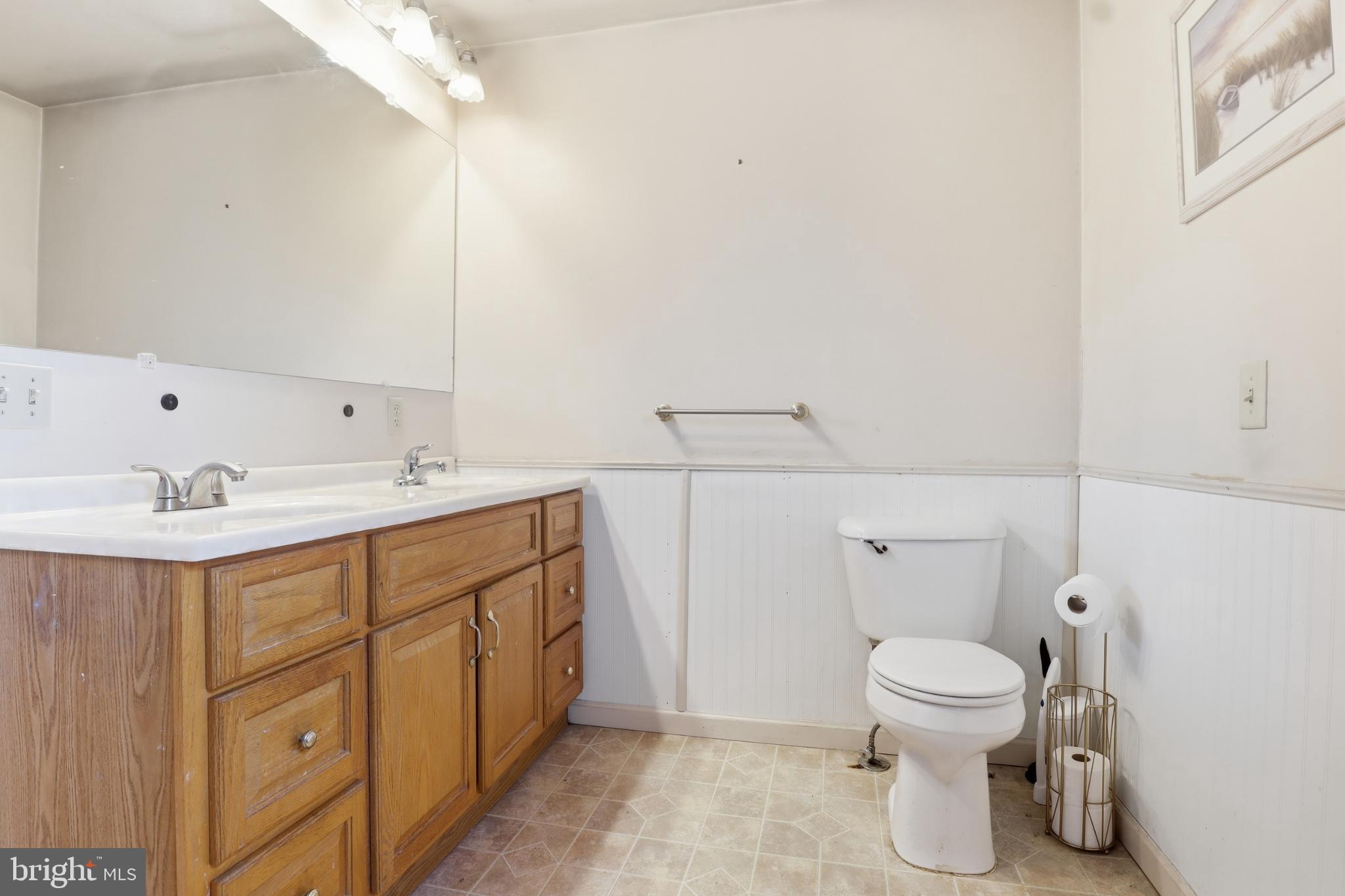 4849 Springtop Drive Harrisburg, PA 17111 - Photo 22 of 42 a spacious bathroom with a toilet sink and mirror