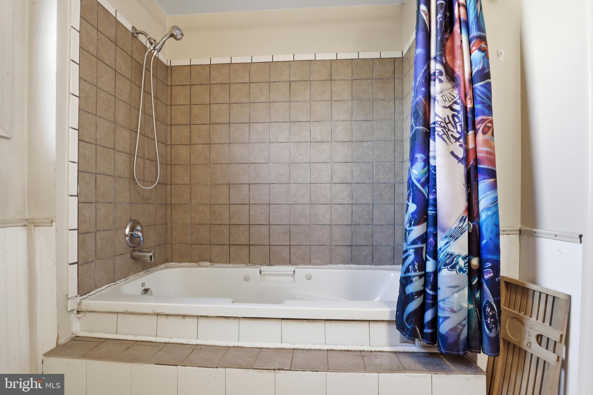 4849 Springtop Drive Harrisburg, PA 17111 - Photo 23 of 42 a bathroom with a bathtub and shower