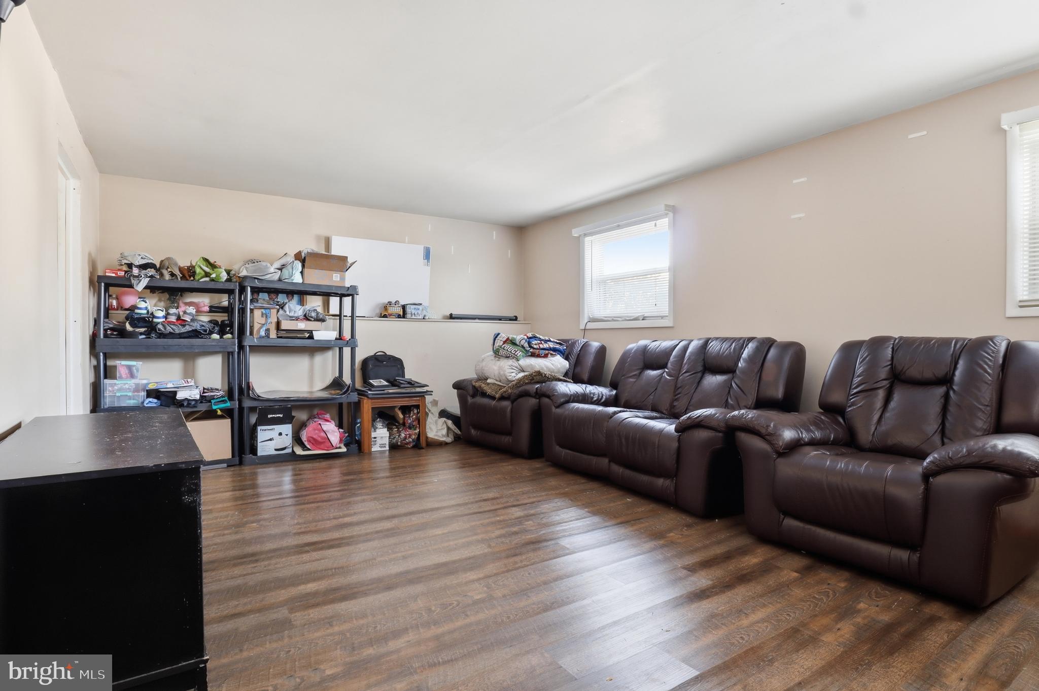 4849 Springtop Drive Harrisburg, PA 17111 - Photo 24 of 42 a living room with furniture and a wooden floor