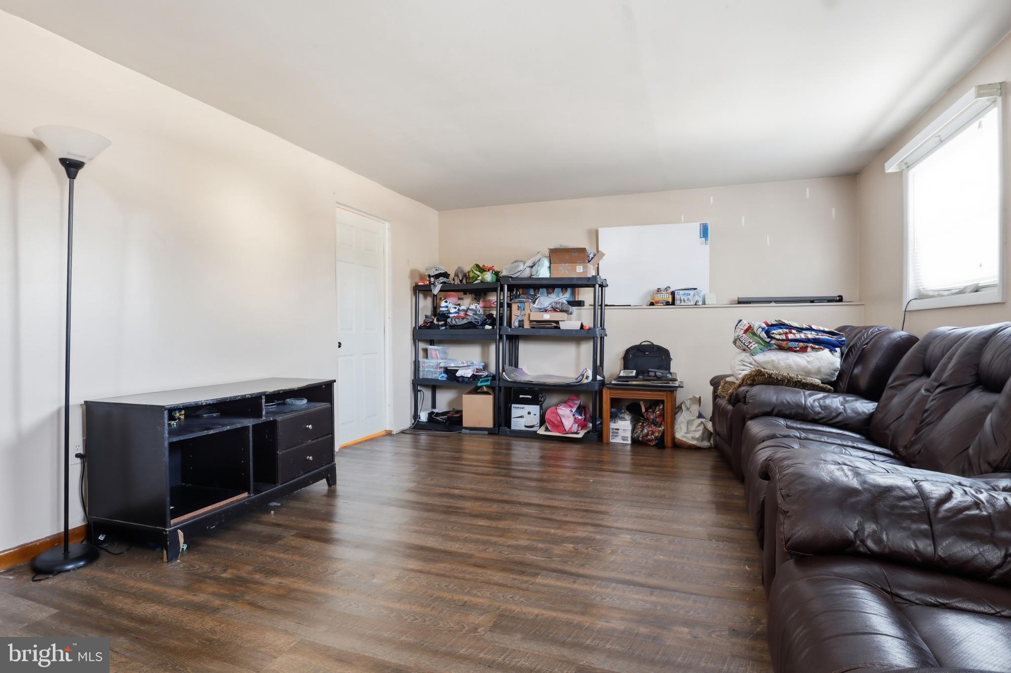 4849 Springtop Drive Harrisburg, PA 17111 - Photo 25 of 42 a living room with furniture and a wooden floor