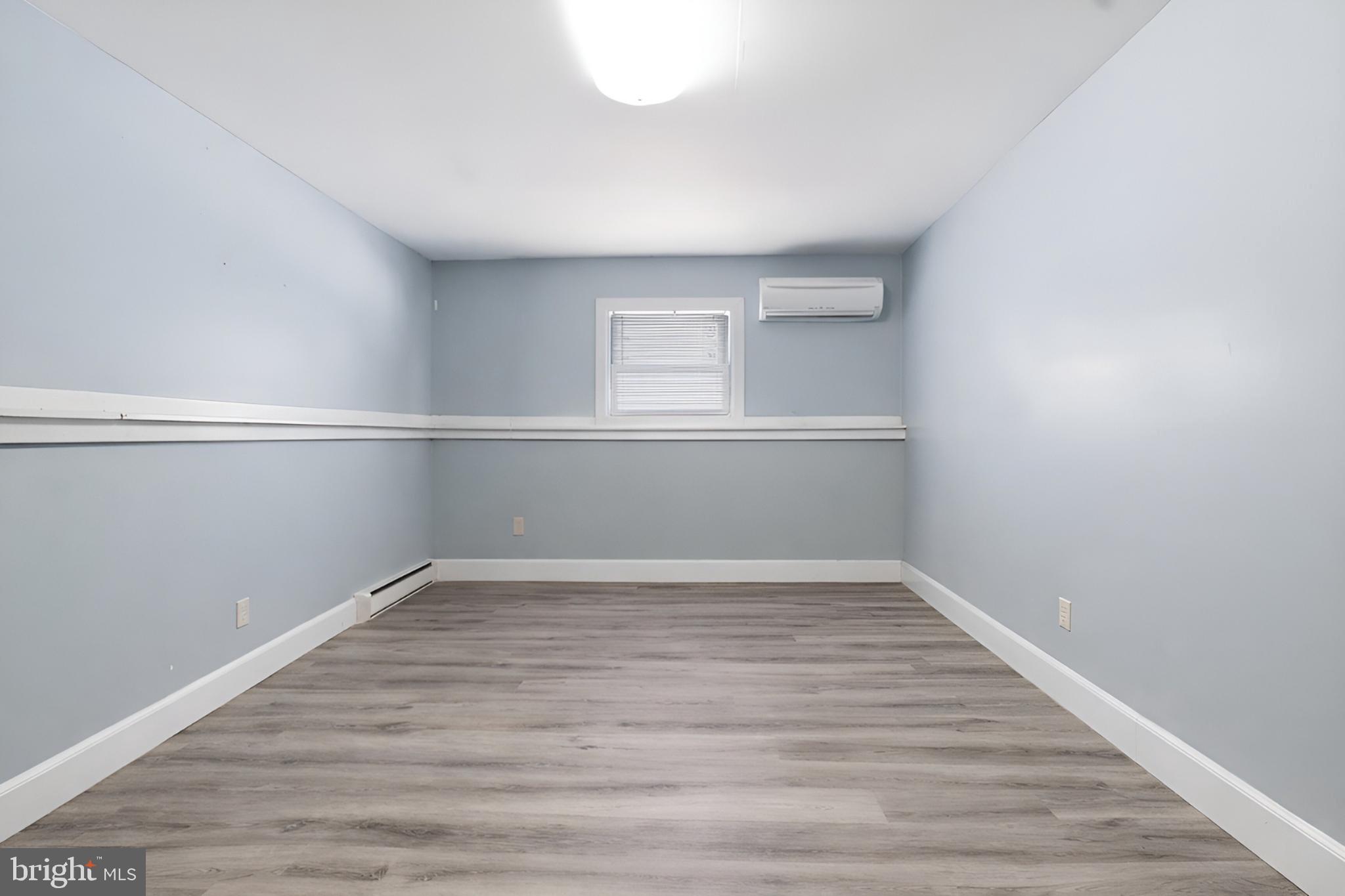 4849 Springtop Drive Harrisburg, PA 17111 - Photo 28 of 42 a view of an empty room with wooden floor and a window