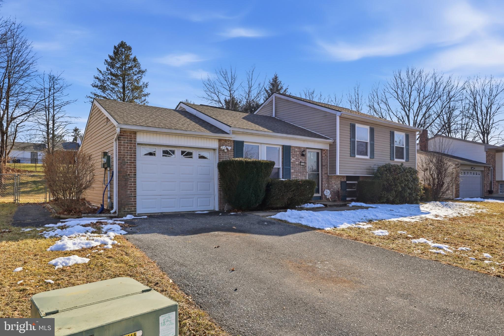 4849 Springtop Drive Harrisburg, PA 17111 - Photo 3 of 42 a view of a house with snow on the side of the road